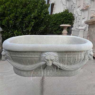 Wholesale Hand Carved Freestanding Oval Natural Stone Bathtub with Lion Head for sale 